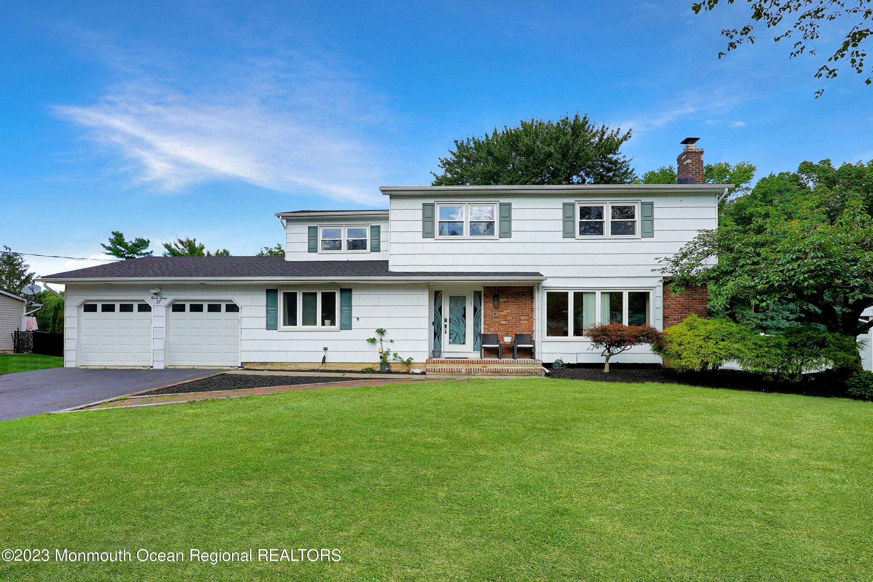 37 Prince William Road Morganville, NJ 07751 - Photo 1 of 35 a view of a house with a yard and sitting area