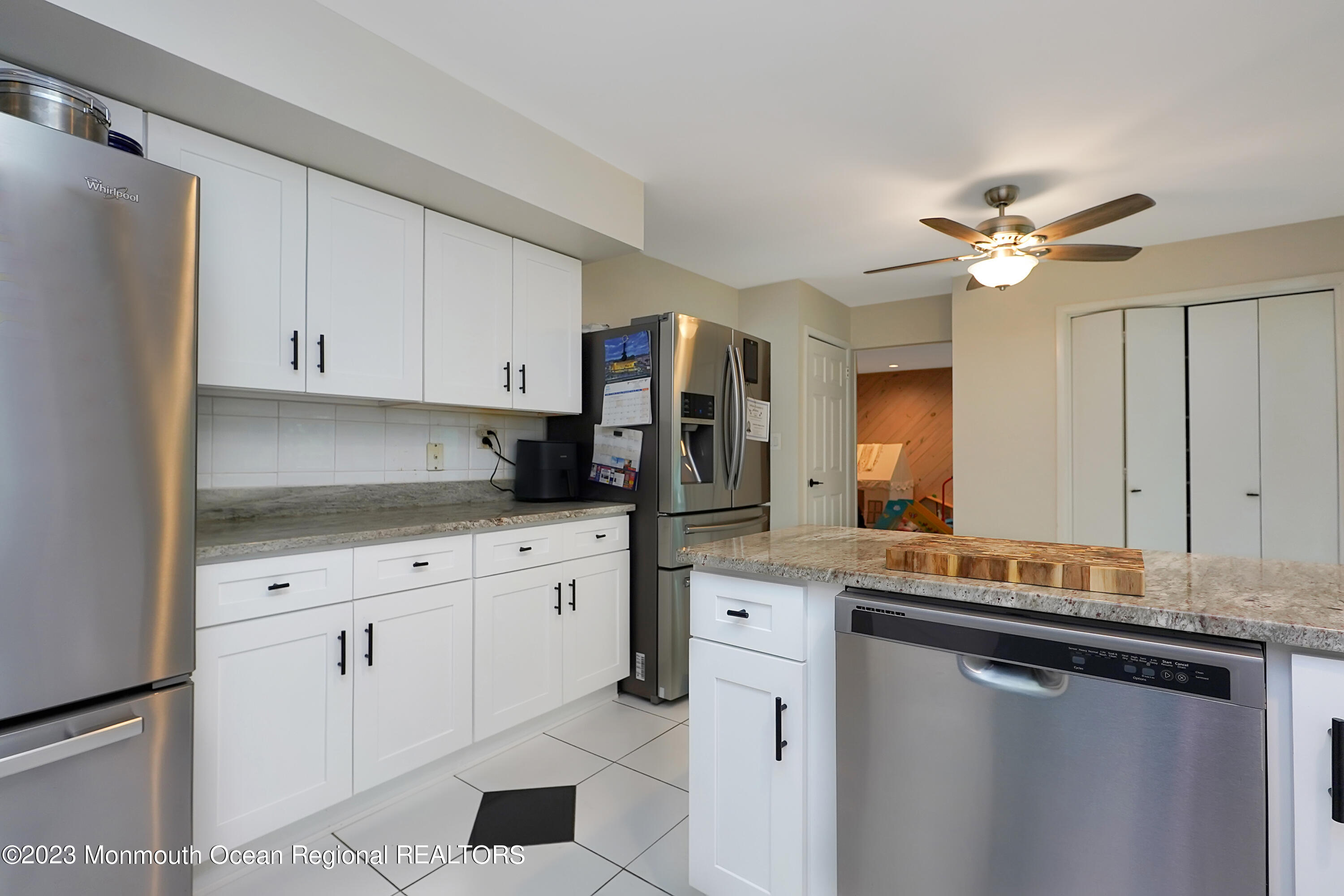 37 Prince William Road Morganville, NJ 07751 - Photo 12 of 35 a kitchen with stainless steel appliances granite countertop a stove a sink and a refrigerator