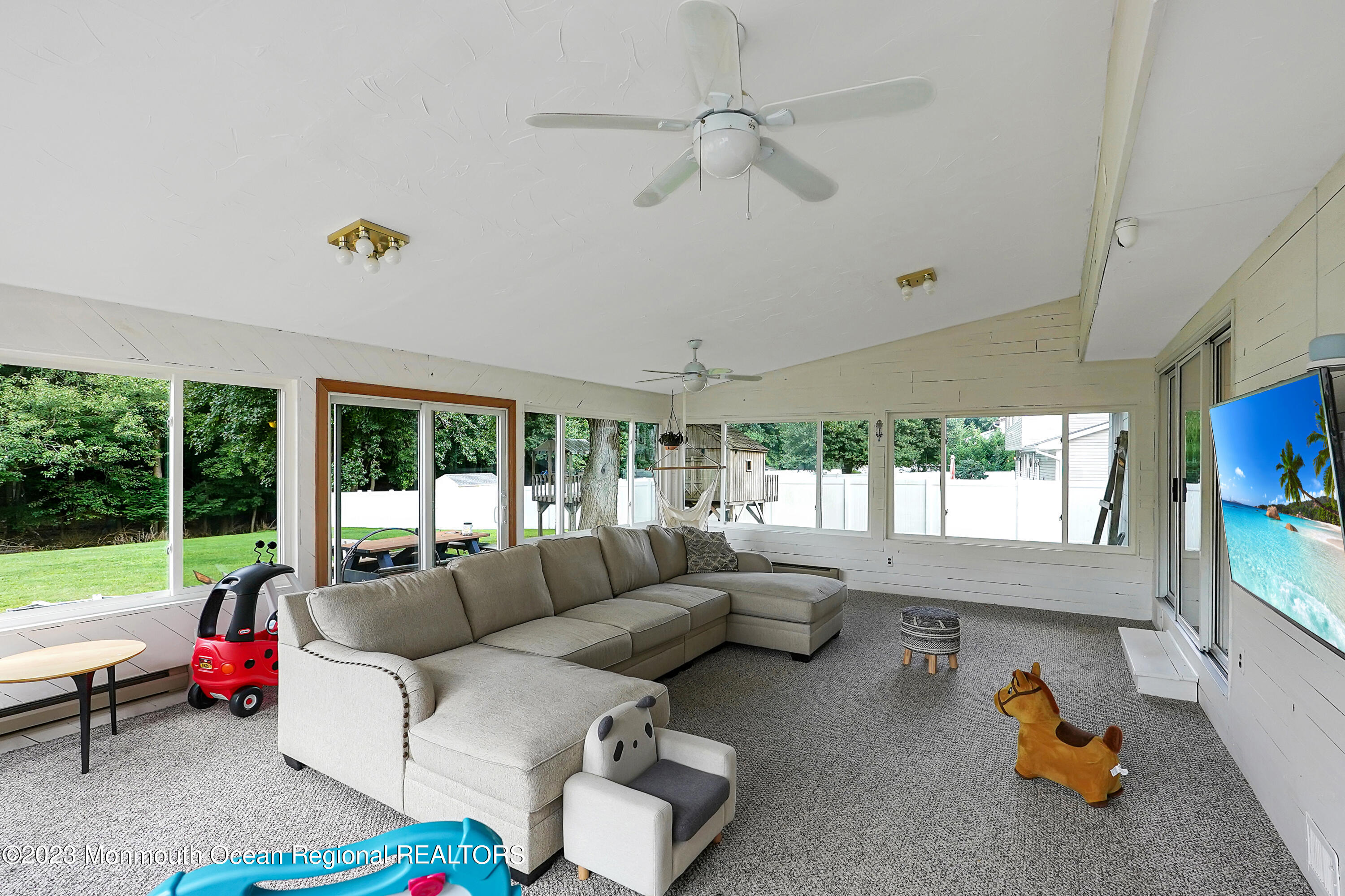 37 Prince William Road Morganville, NJ 07751 - Photo 14 of 35 a living room with furniture and a large window