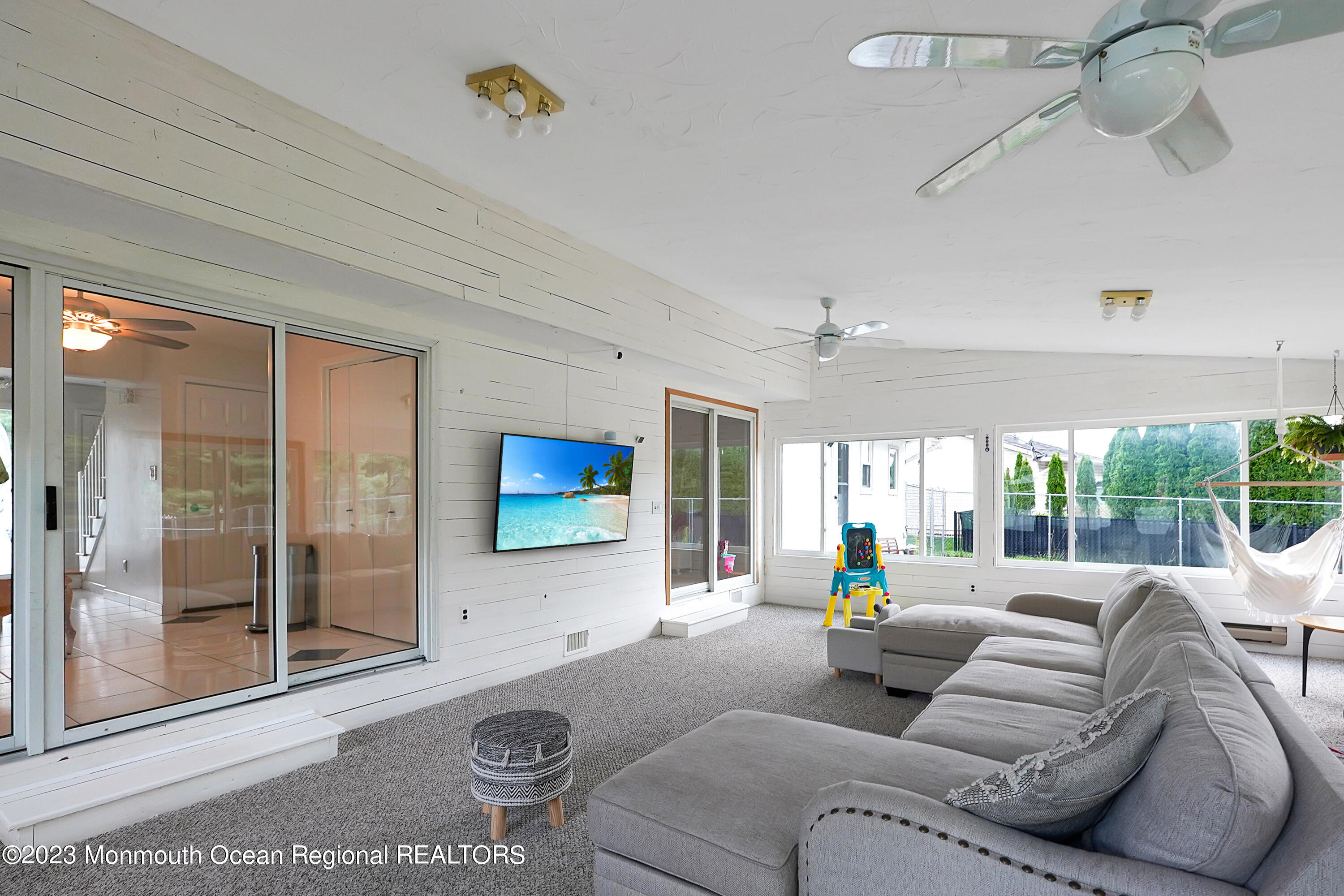 37 Prince William Road Morganville, NJ 07751 - Photo 15 of 35 a living room with furniture and a flat screen tv