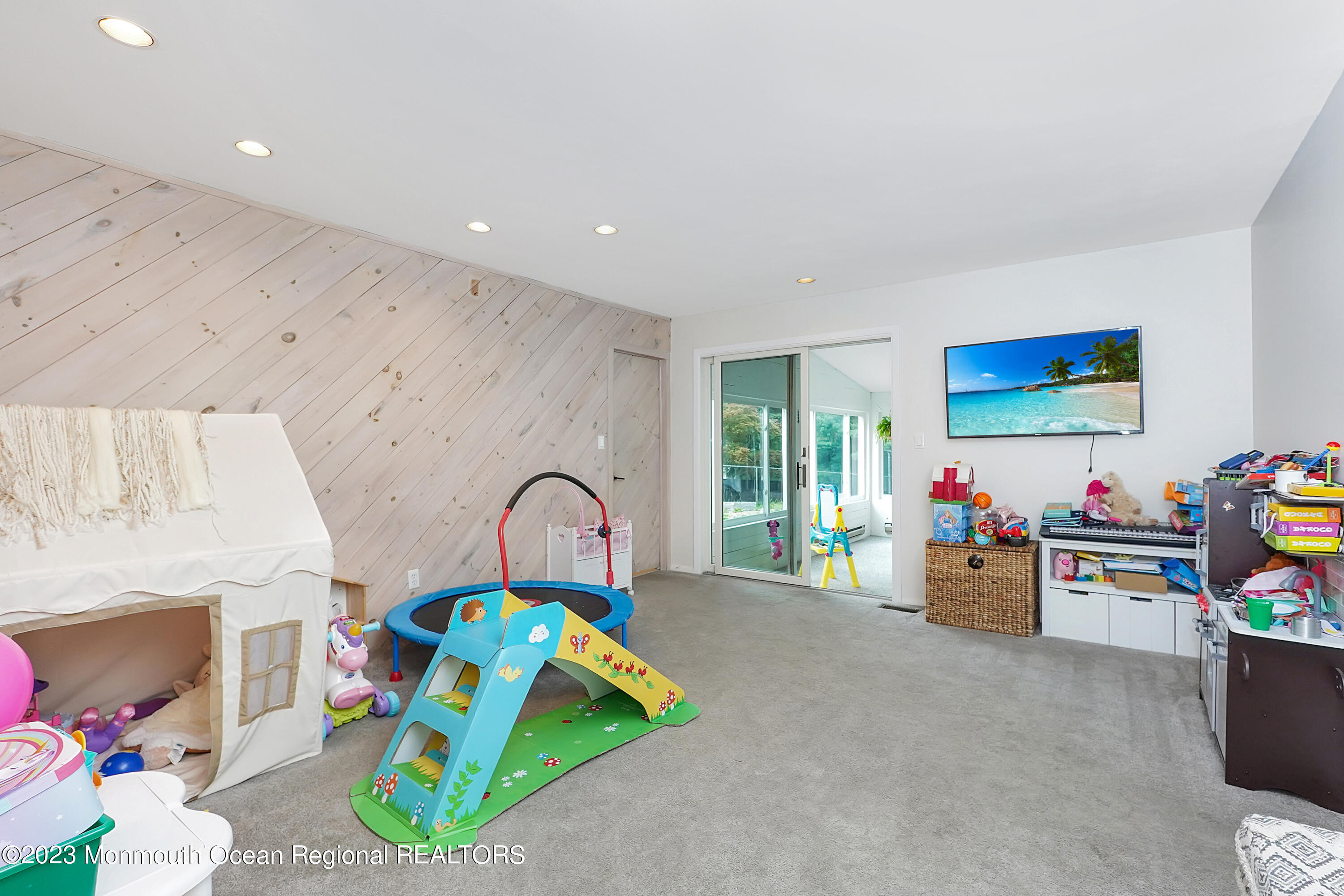 37 Prince William Road Morganville, NJ 07751 - Photo 16 of 35 a living room with lots of furniture and toys