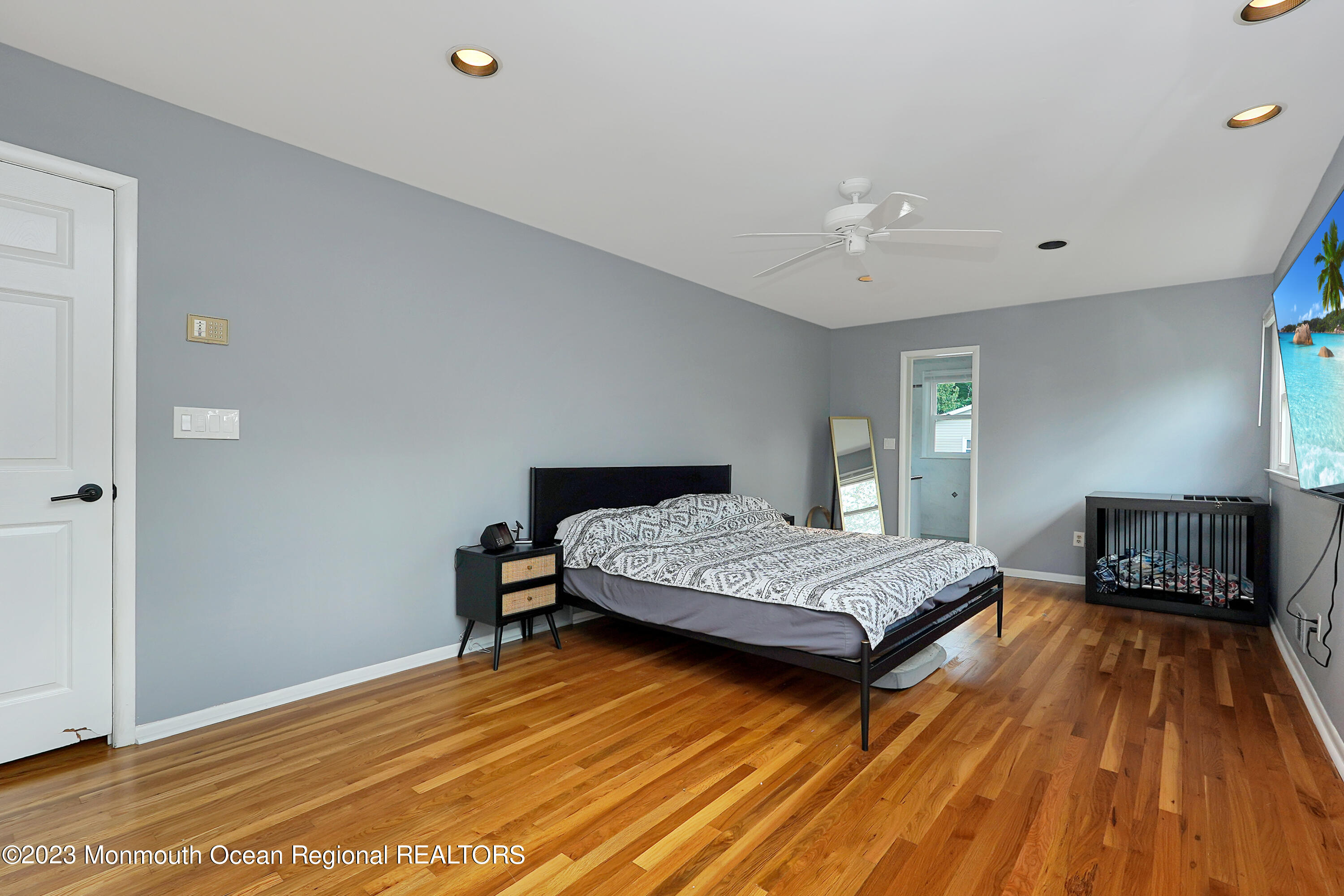 37 Prince William Road Morganville, NJ 07751 - Photo 18 of 35 a bedroom with a bed and wooden floor
