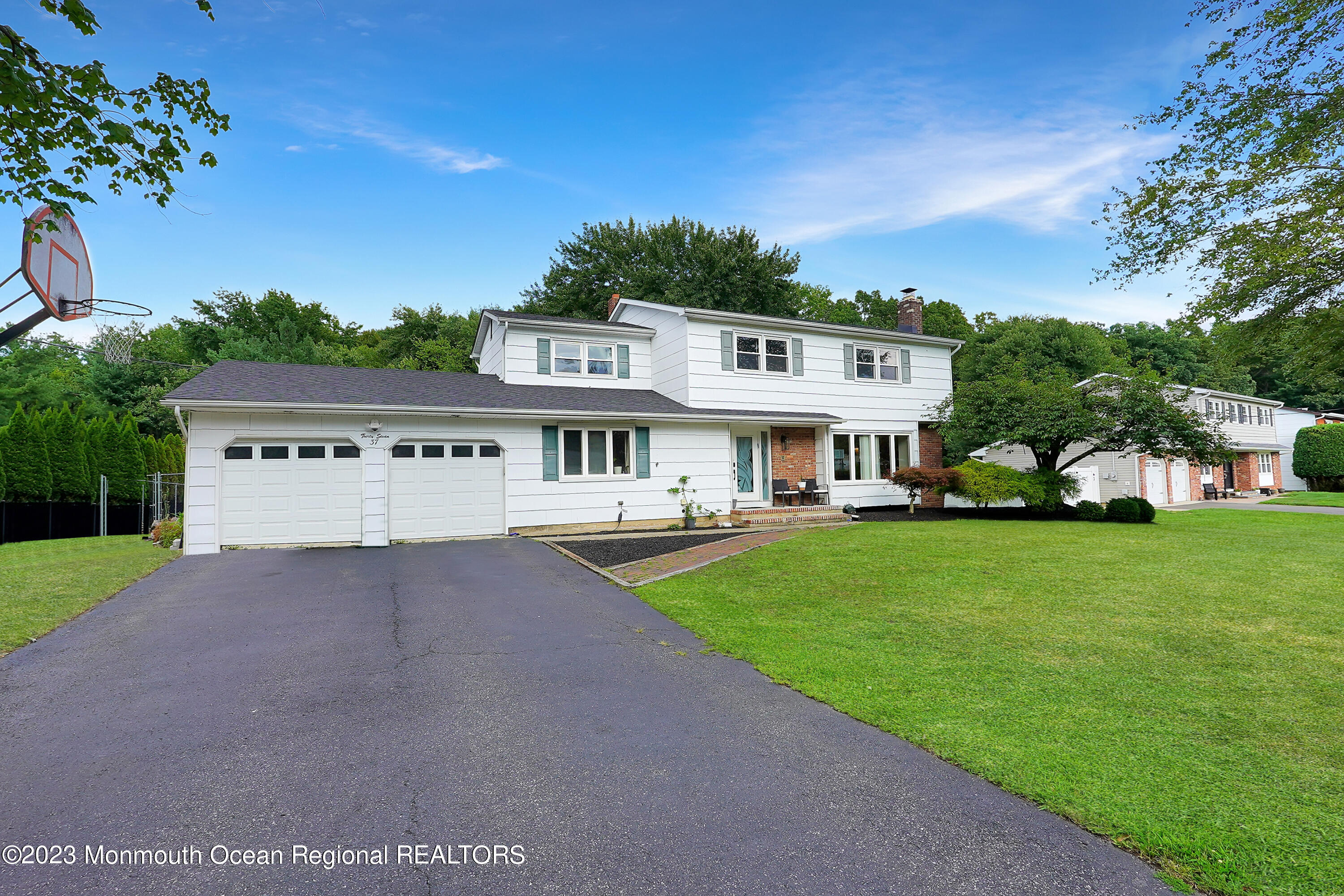37 Prince William Road Morganville, NJ 07751 - Photo 2 of 35 a view of house with yard and entertaining space