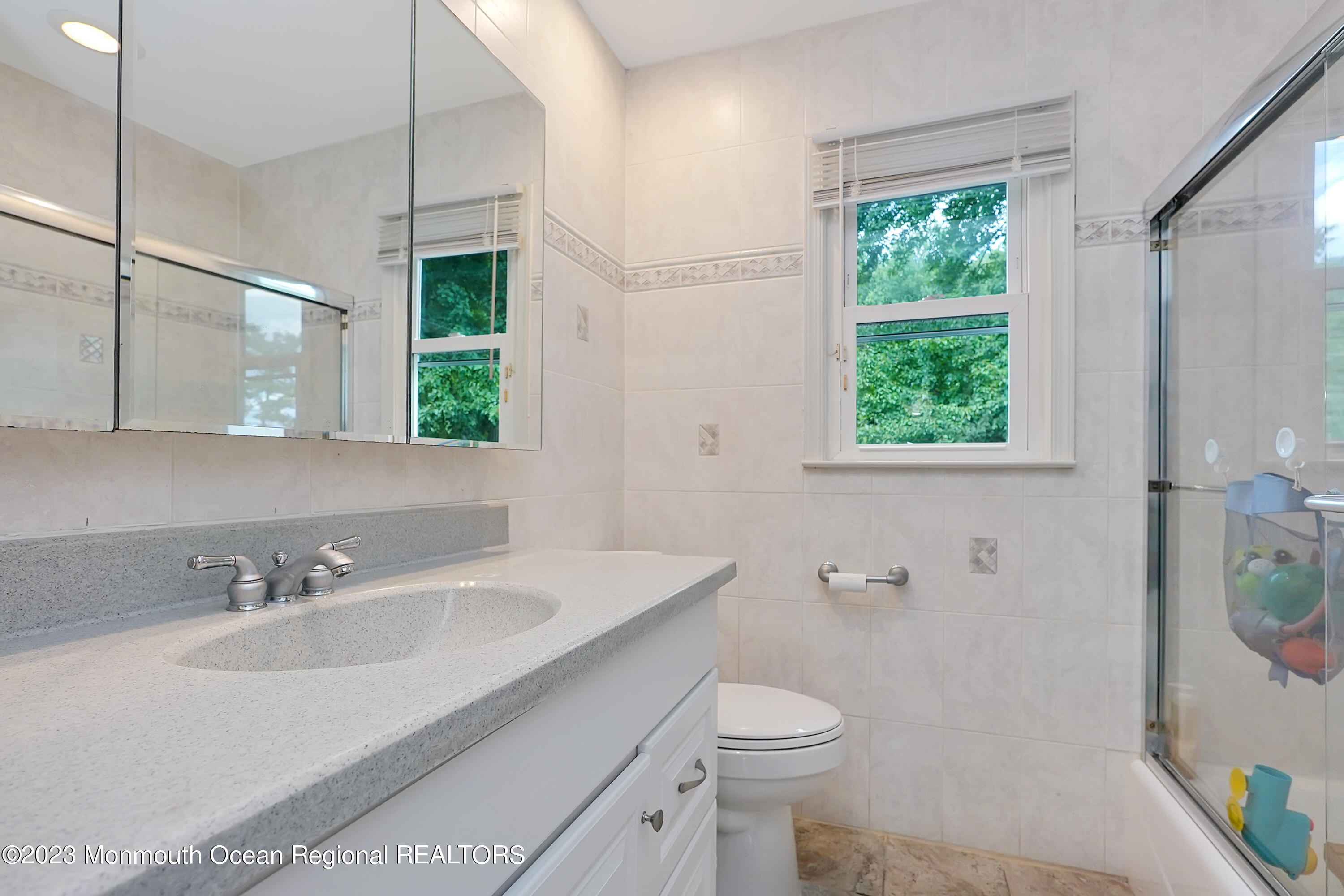 37 Prince William Road Morganville, NJ 07751 - Photo 21 of 35 a bathroom with a sink toilet and a mirror