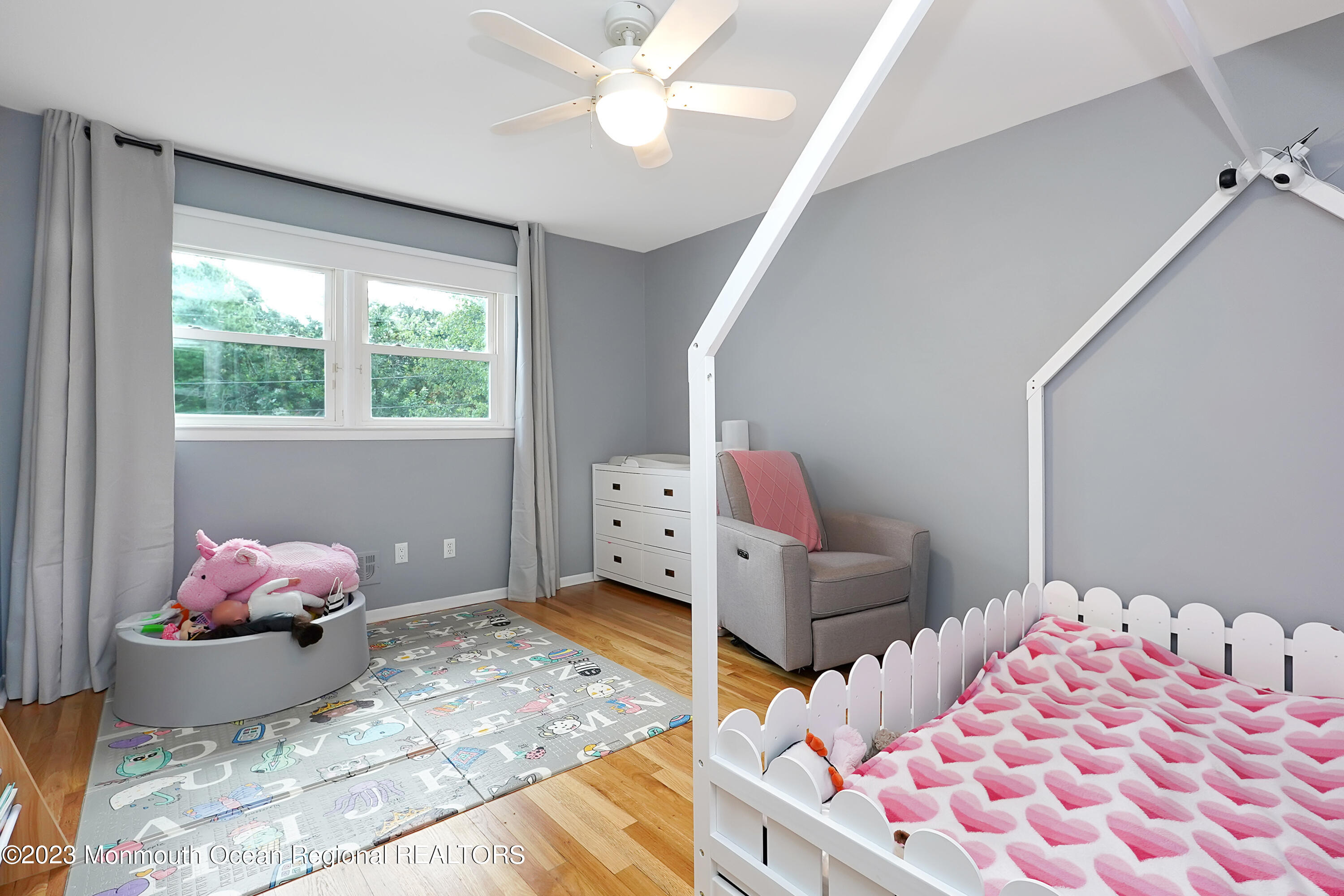 37 Prince William Road Morganville, NJ 07751 - Photo 23 of 35 a bedroom with a bed and window