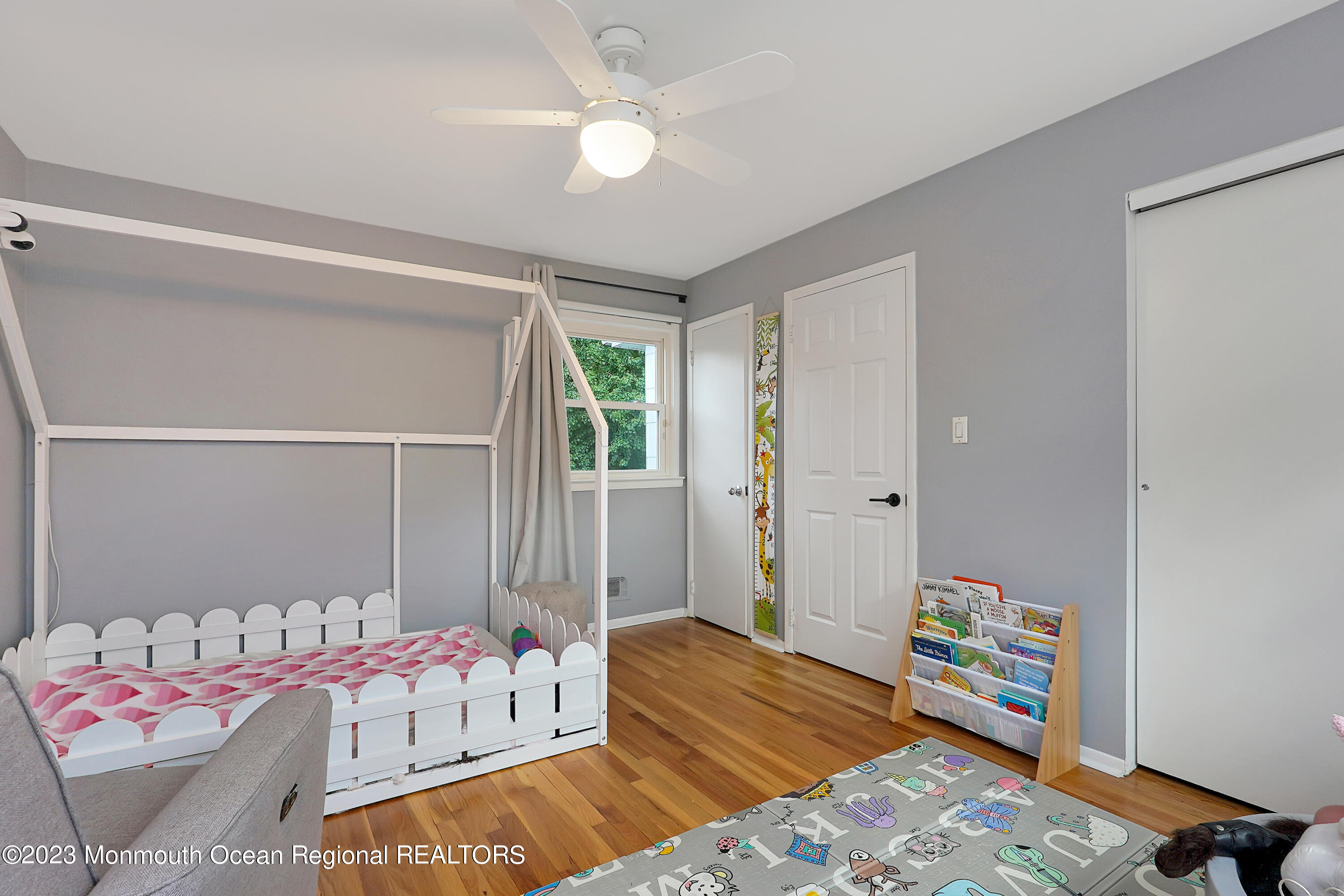 37 Prince William Road Morganville, NJ 07751 - Photo 24 of 35 a bedroom with a bed and a chandelier