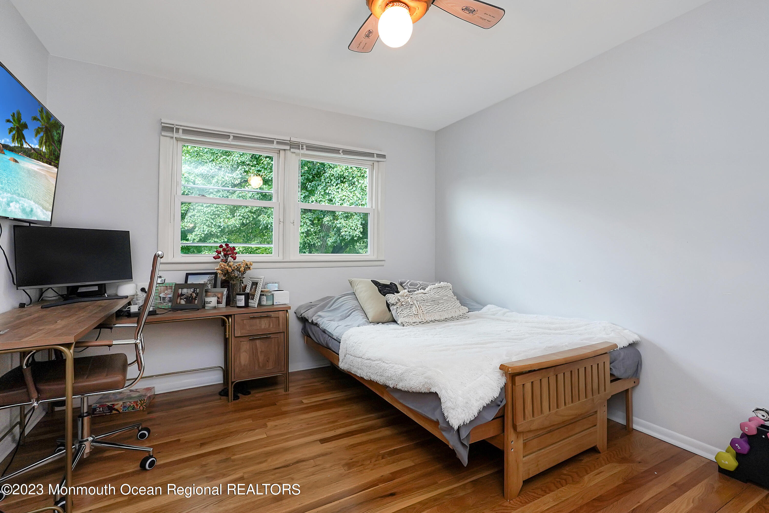 37 Prince William Road Morganville, NJ 07751 - Photo 25 of 35 a bedroom with a bed and a flat screen tv