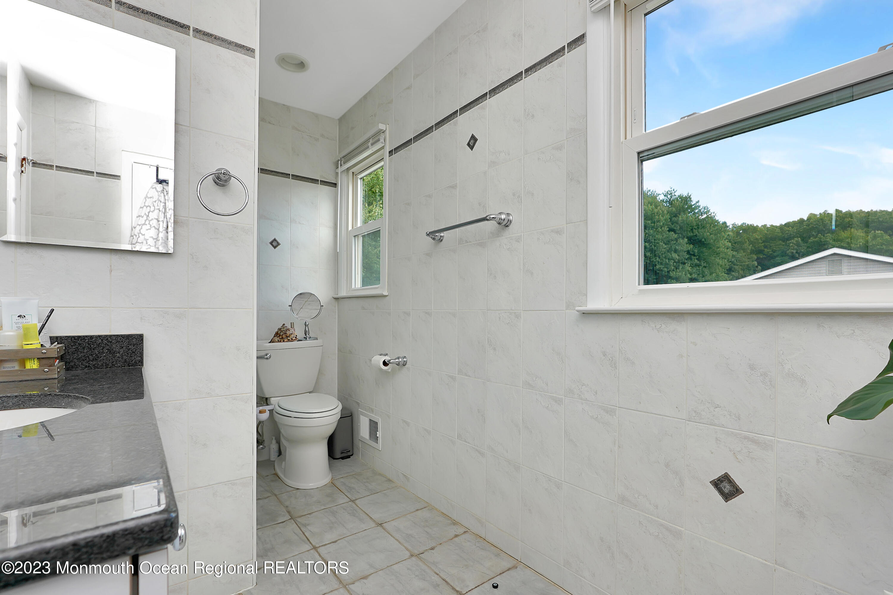 37 Prince William Road Morganville, NJ 07751 - Photo 26 of 35 a bathroom with a sink toilet and shower