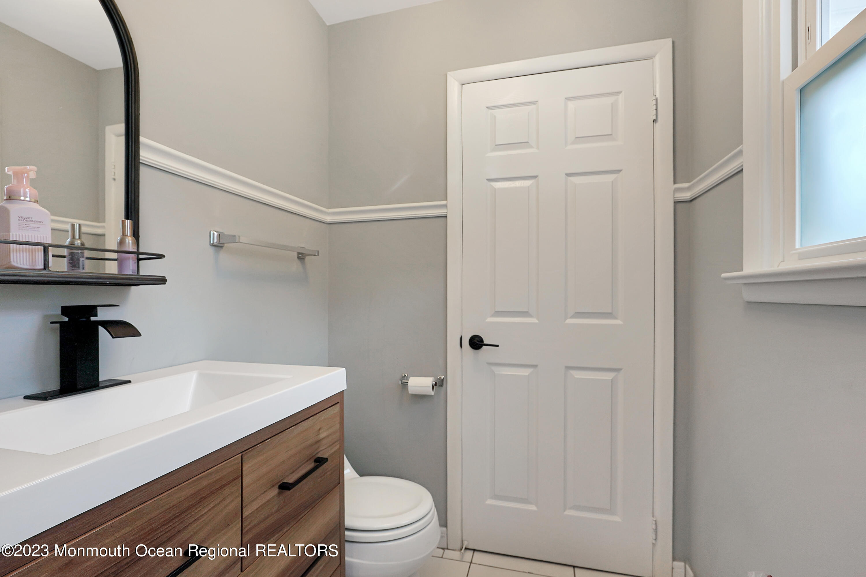 37 Prince William Road Morganville, NJ 07751 - Photo 27 of 35 a bathroom with a sink a toilet and shower