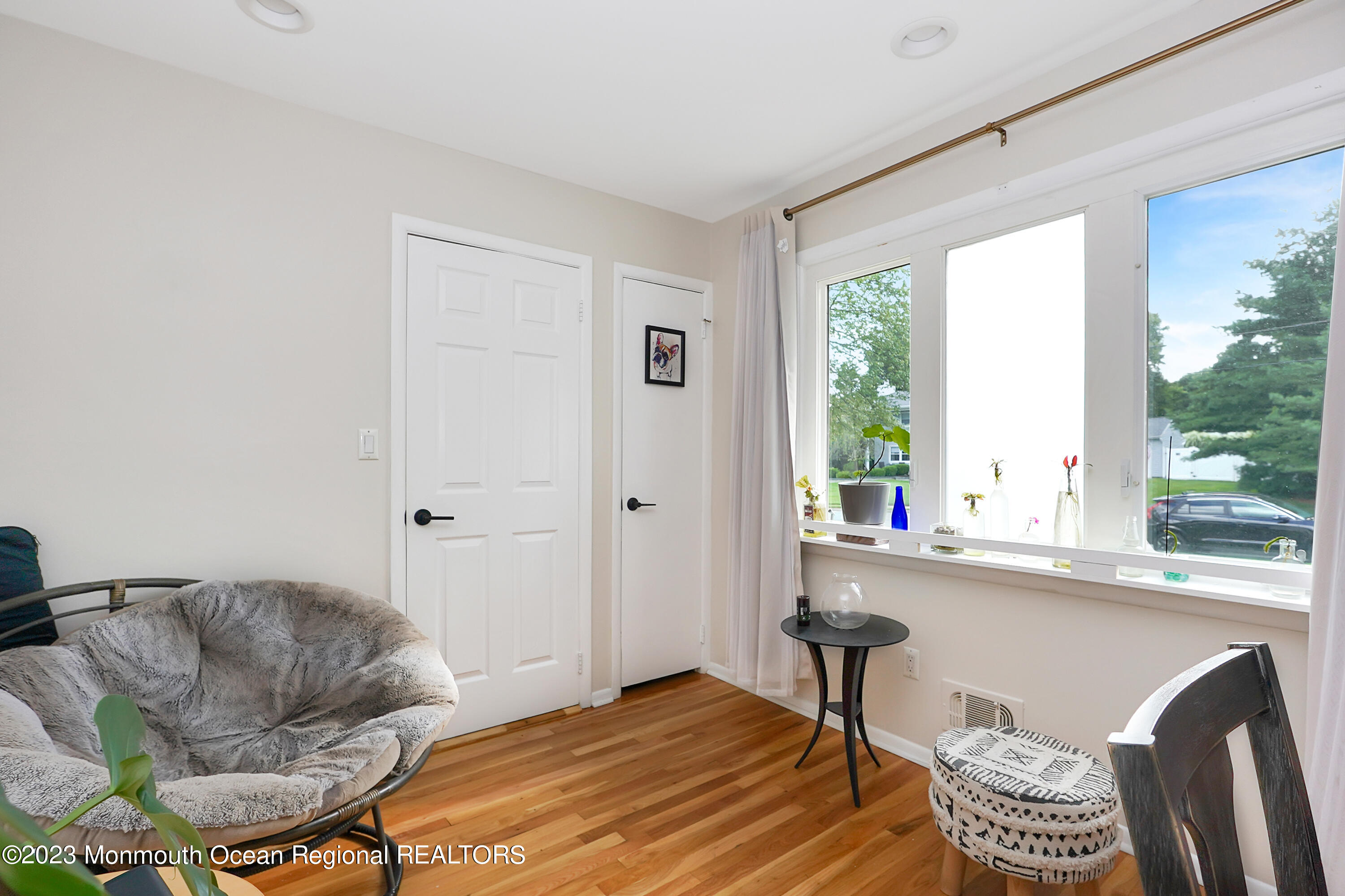 37 Prince William Road Morganville, NJ 07751 - Photo 28 of 35 a living room with furniture and a large window