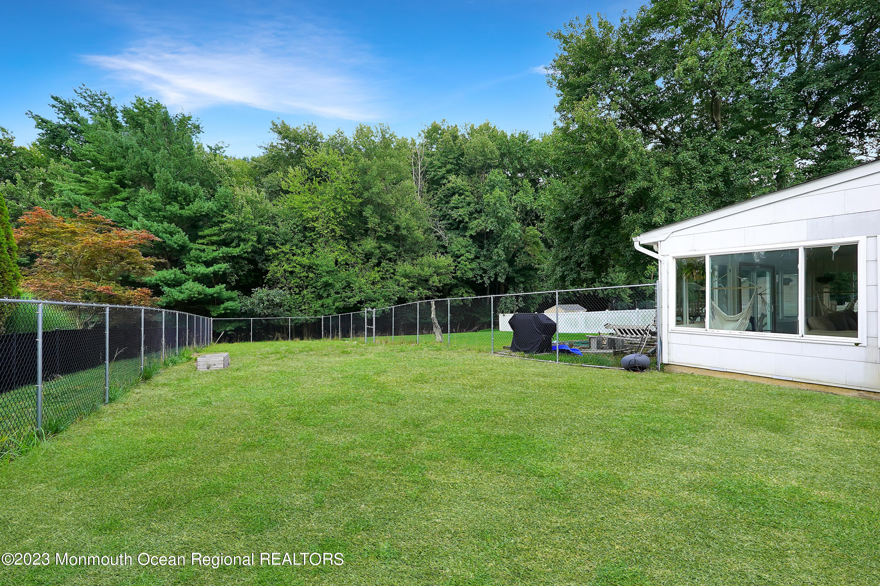 37 Prince William Road Morganville, NJ 07751 - Photo 32 of 35 a view of a house with backyard