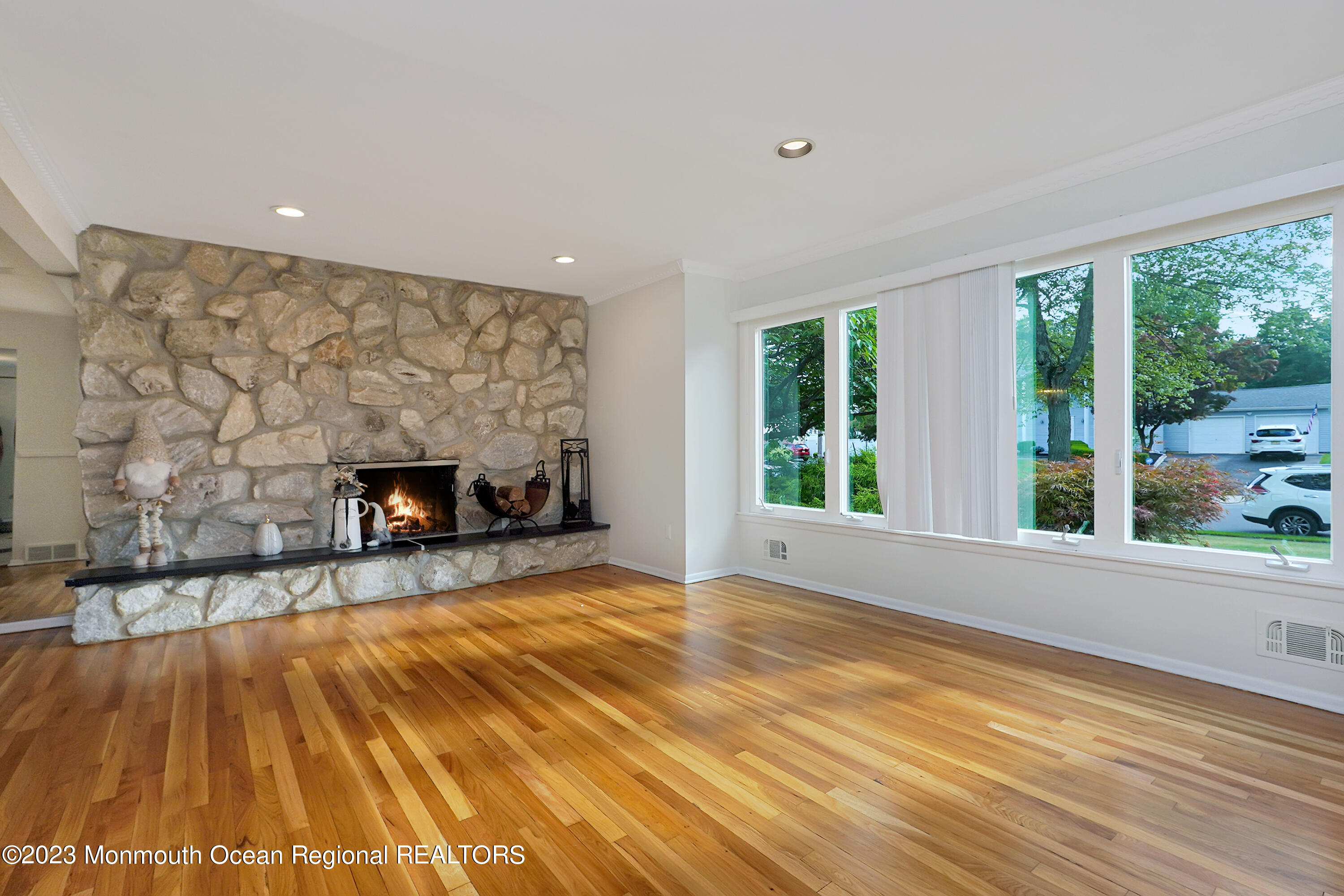 37 Prince William Road Morganville, NJ 07751 - Photo 5 of 35 a view of empty room with wooden floor and fireplace
