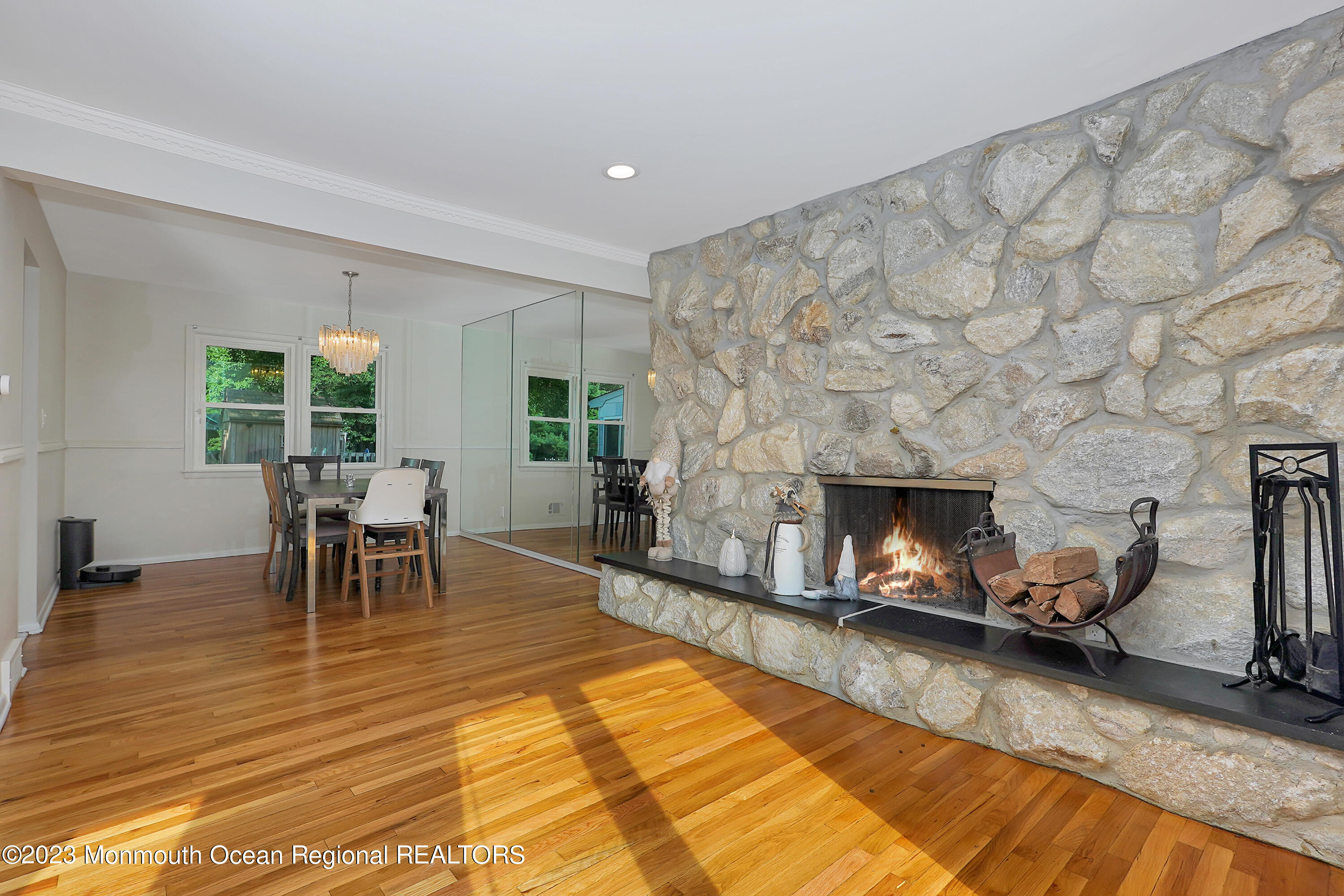 37 Prince William Road Morganville, NJ 07751 - Photo 7 of 35 a living room with furniture and a fireplace