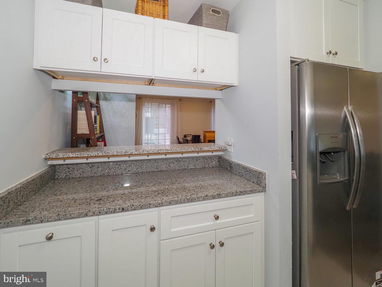 612 South Charles Street, Unit R 36 Baltimore, MD 21230 - Photo 12 of 37 a kitchen with stainless steel appliances granite countertop a refrigerator and a sink
