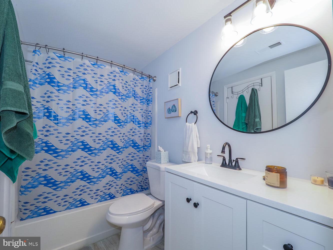 612 South Charles Street, Unit R 36 Baltimore, MD 21230 - Photo 15 of 37 a bathroom with a toilet a sink and mirror