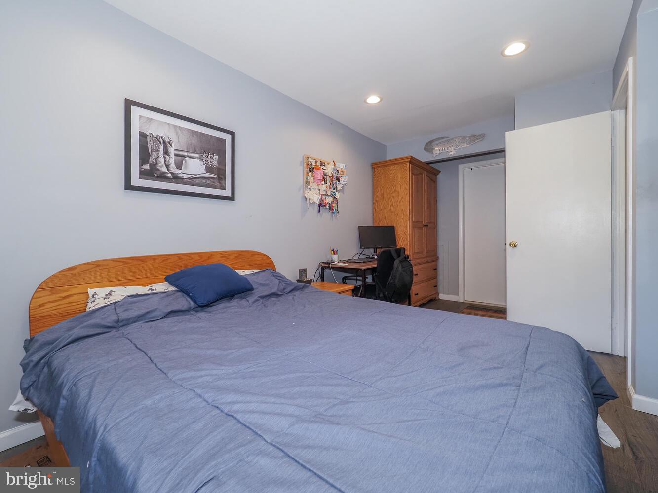 612 South Charles Street, Unit R 36 Baltimore, MD 21230 - Photo 18 of 37 a bed room with a bed and a large mirror