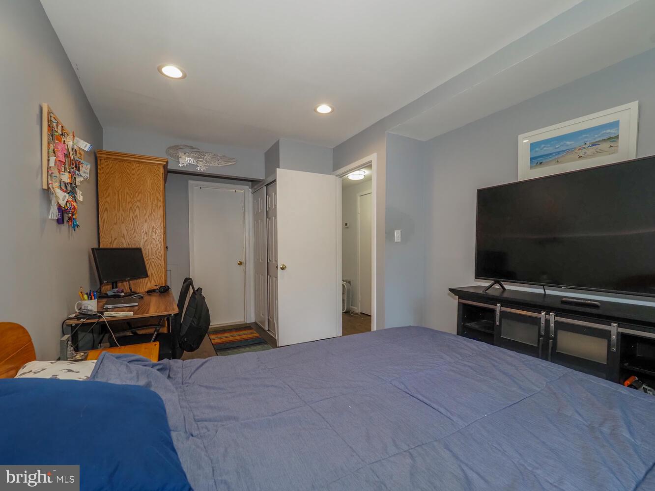 612 South Charles Street, Unit R 36 Baltimore, MD 21230 - Photo 19 of 37 a bedroom with furniture and a flat screen tv