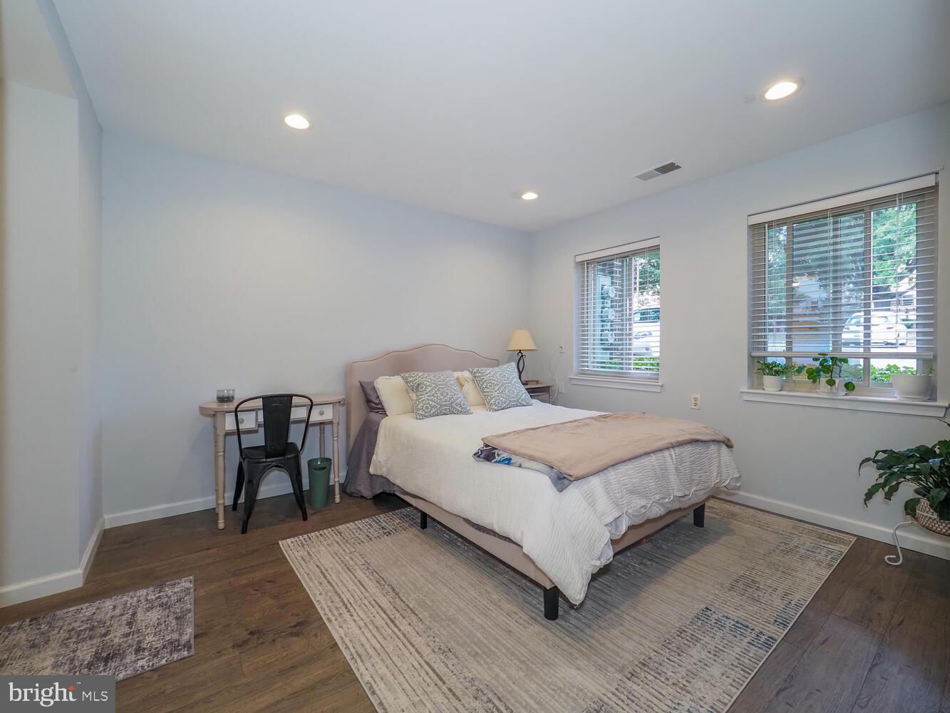 612 South Charles Street, Unit R 36 Baltimore, MD 21230 - Photo 21 of 37 a bedroom with a bed a lamp and potted plant