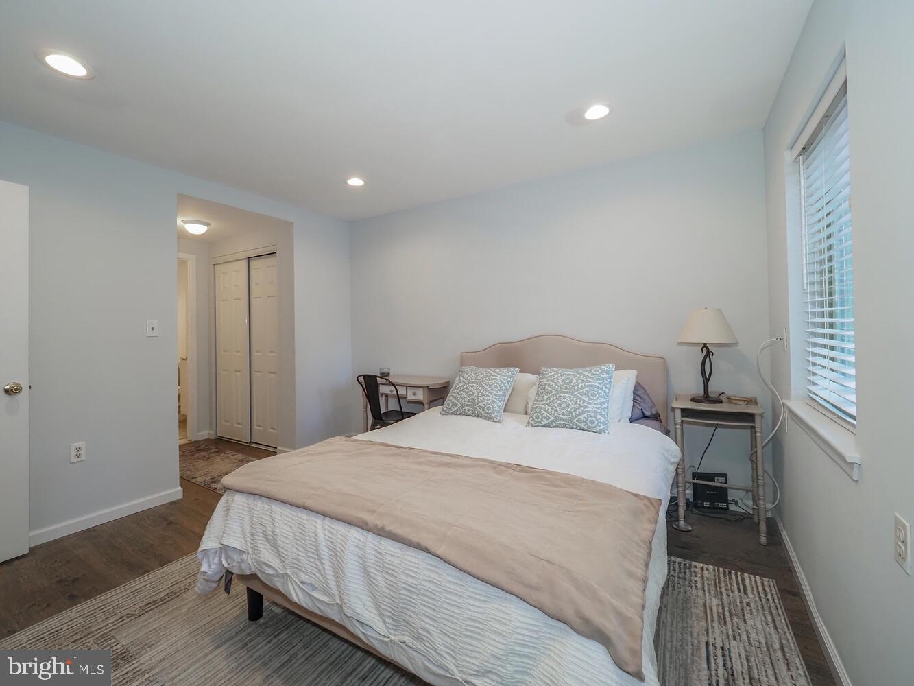 612 South Charles Street, Unit R 36 Baltimore, MD 21230 - Photo 23 of 37 a bedroom with a bed and a night stand