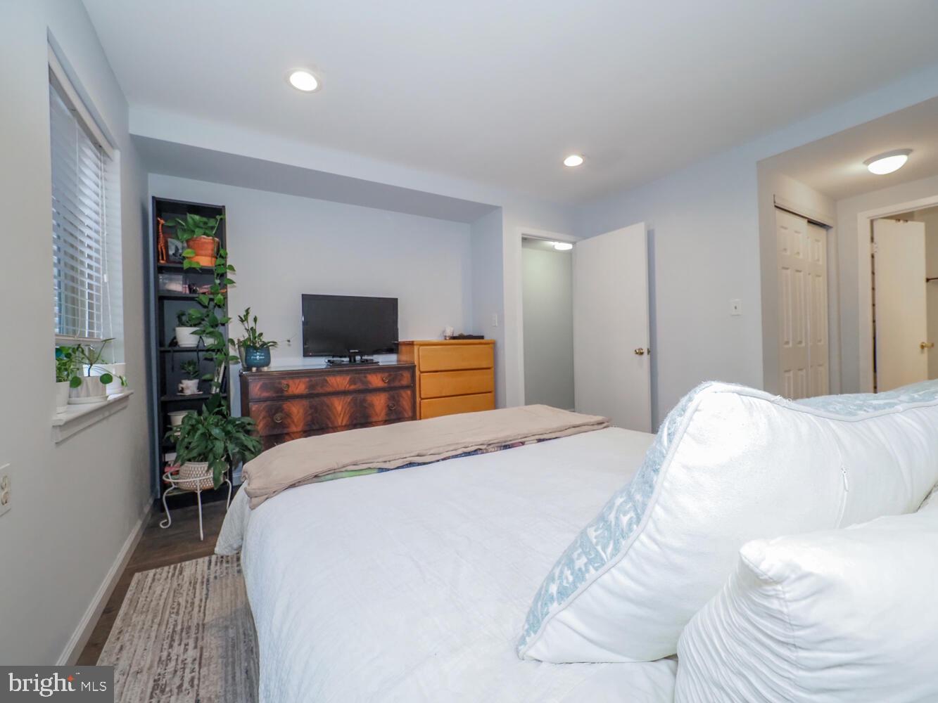 612 South Charles Street, Unit R 36 Baltimore, MD 21230 - Photo 24 of 37 a bedroom with a bed and a flat screen tv