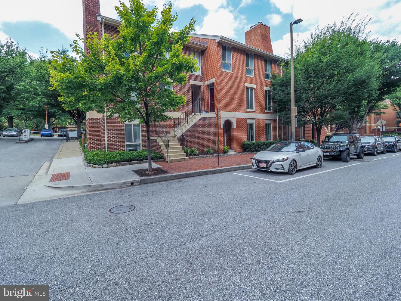 612 South Charles Street, Unit R 36 Baltimore, MD 21230 - Photo 29 of 37 a car parked in front of white house