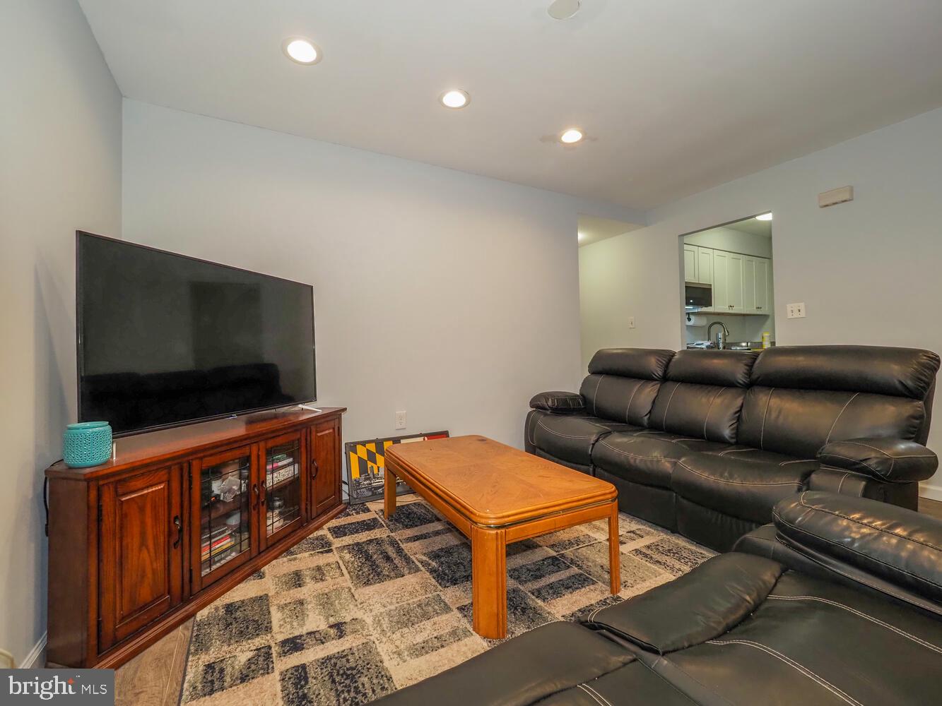 612 South Charles Street, Unit R 36 Baltimore, MD 21230 - Photo 6 of 37 a living room with furniture and a flat screen tv