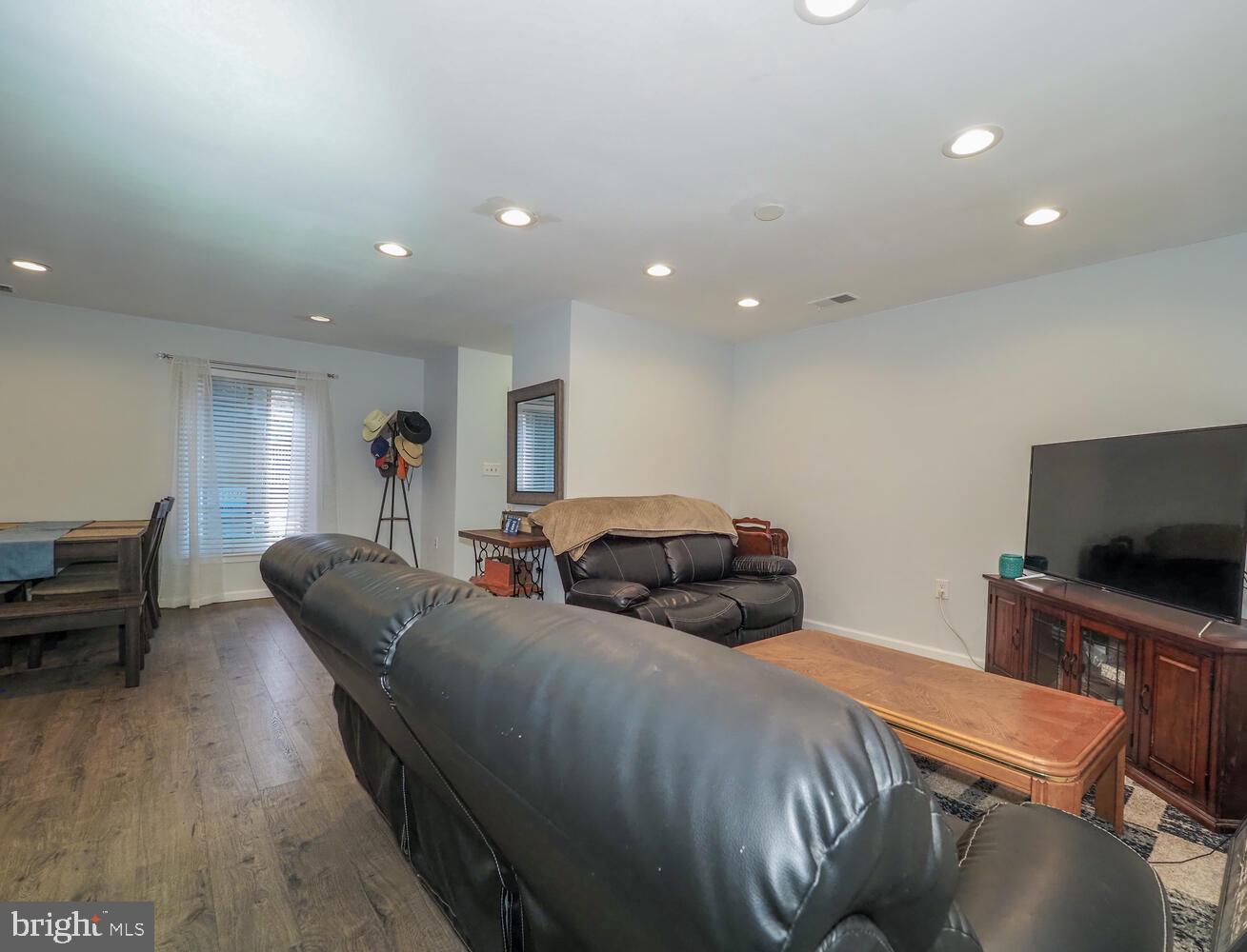612 South Charles Street, Unit R 36 Baltimore, MD 21230 - Photo 8 of 37 a bedroom with furniture and a flat screen tv