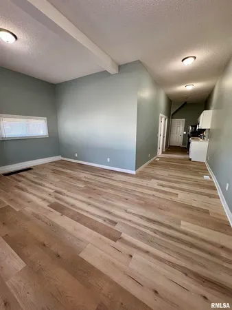 a view of a livingroom with a staircase