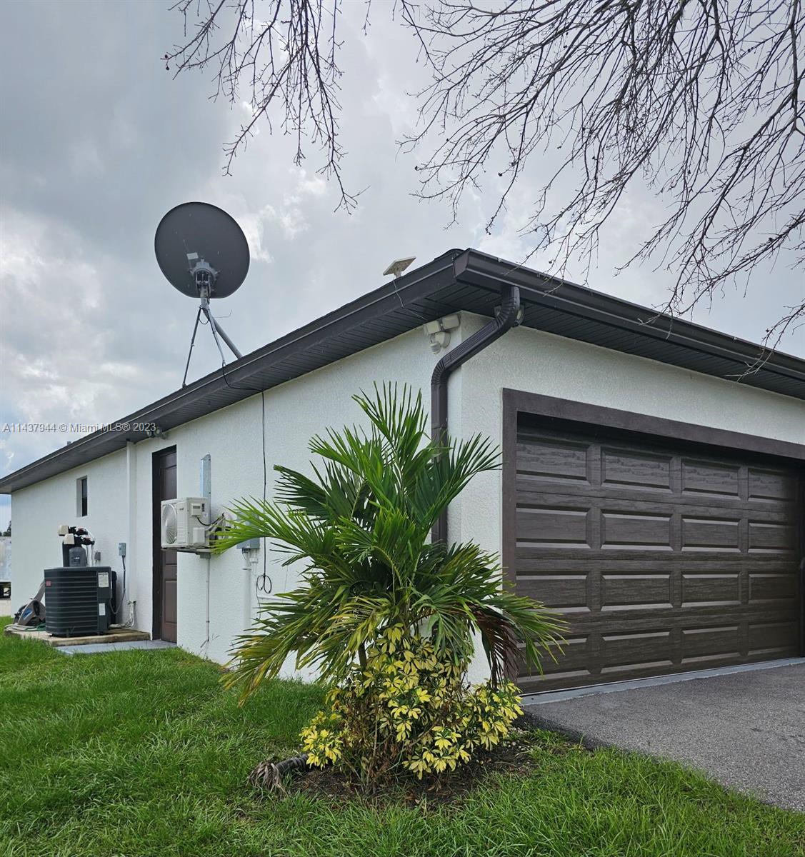 490 37th Avenue Northwest Naples, FL 34120 - Photo 2 of 16 a front view of house with yard