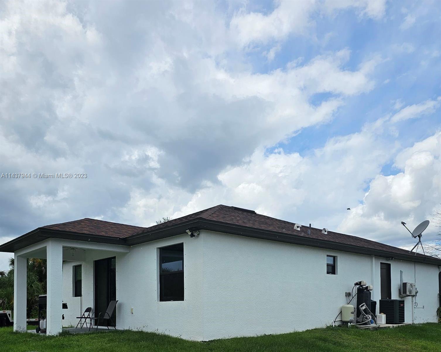 490 37th Avenue Northwest Naples, FL 34120 - Photo 3 of 16 a view of a house with a yard