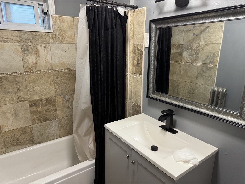 44 Belmont Avenue Springfield, MA 01108 - Photo 2 of 7 a bathroom with a sink and a mirror