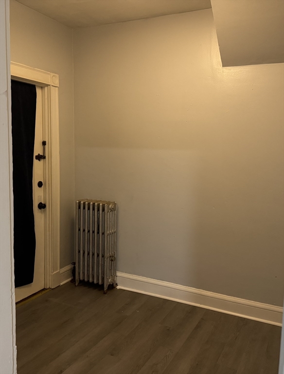 44 Belmont Avenue Springfield, MA 01108 - Photo 7 of 7 an empty room with wooden floor and entryway