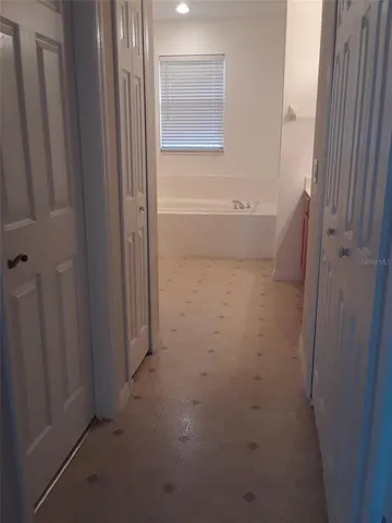 a view of a bathroom with a bathtub