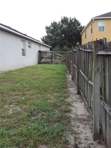 a view of backyard of a house