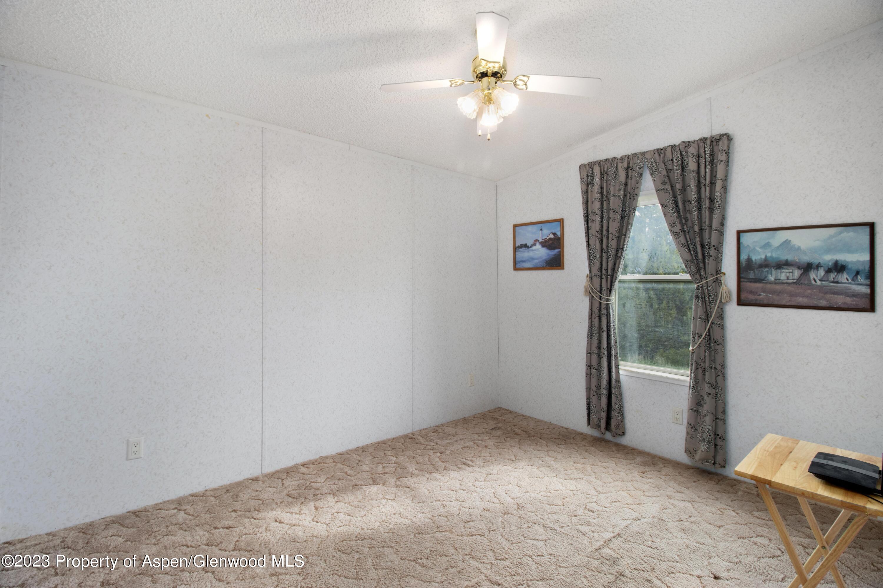 2345 County Road 306 Parachute, CO 81635 - Photo 13 of 29 a view of empty room with windows