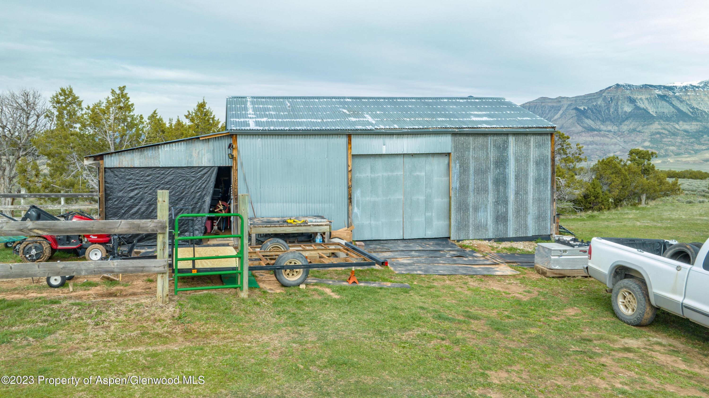 2345 County Road 306 Parachute, CO 81635 - Photo 20 of 29 a view of backyard with barbeque grill and plants