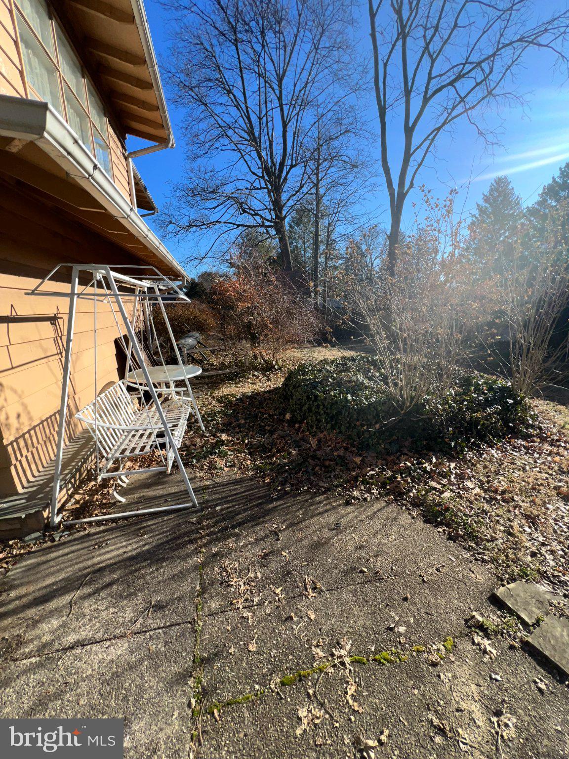 7759 Mellon Road Wyncote, PA 19095 - Photo 3 of 9 Sunny patio with serene greenery.