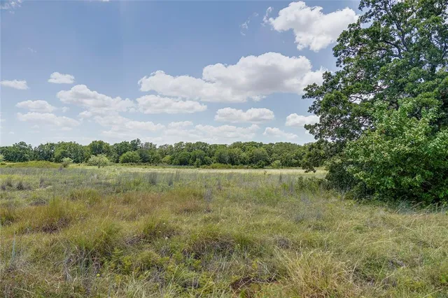 a view of a lake with houses in the back