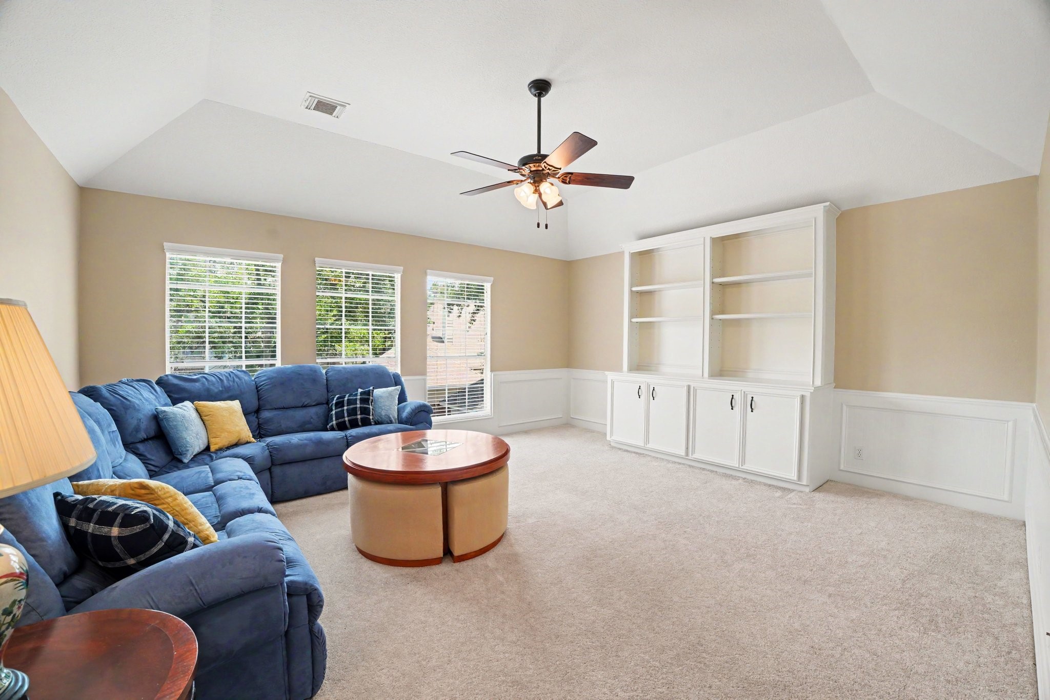 3411 Fir Forest Drive Spring, TX 77388 - Photo 36 of 39 The large game room overlooks the outdoor oasis and features custom built-ins and picture frame wainscoting.