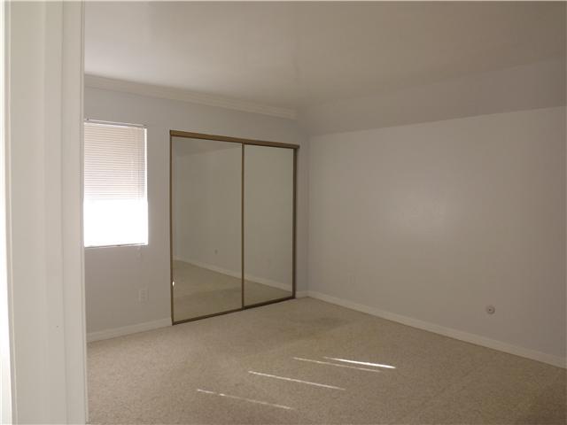 6171 Rancho Mission Road, Unit 205 San Diego, CA 92108 - Photo 6 of 9 Master Bedroom has two large mirrored closets