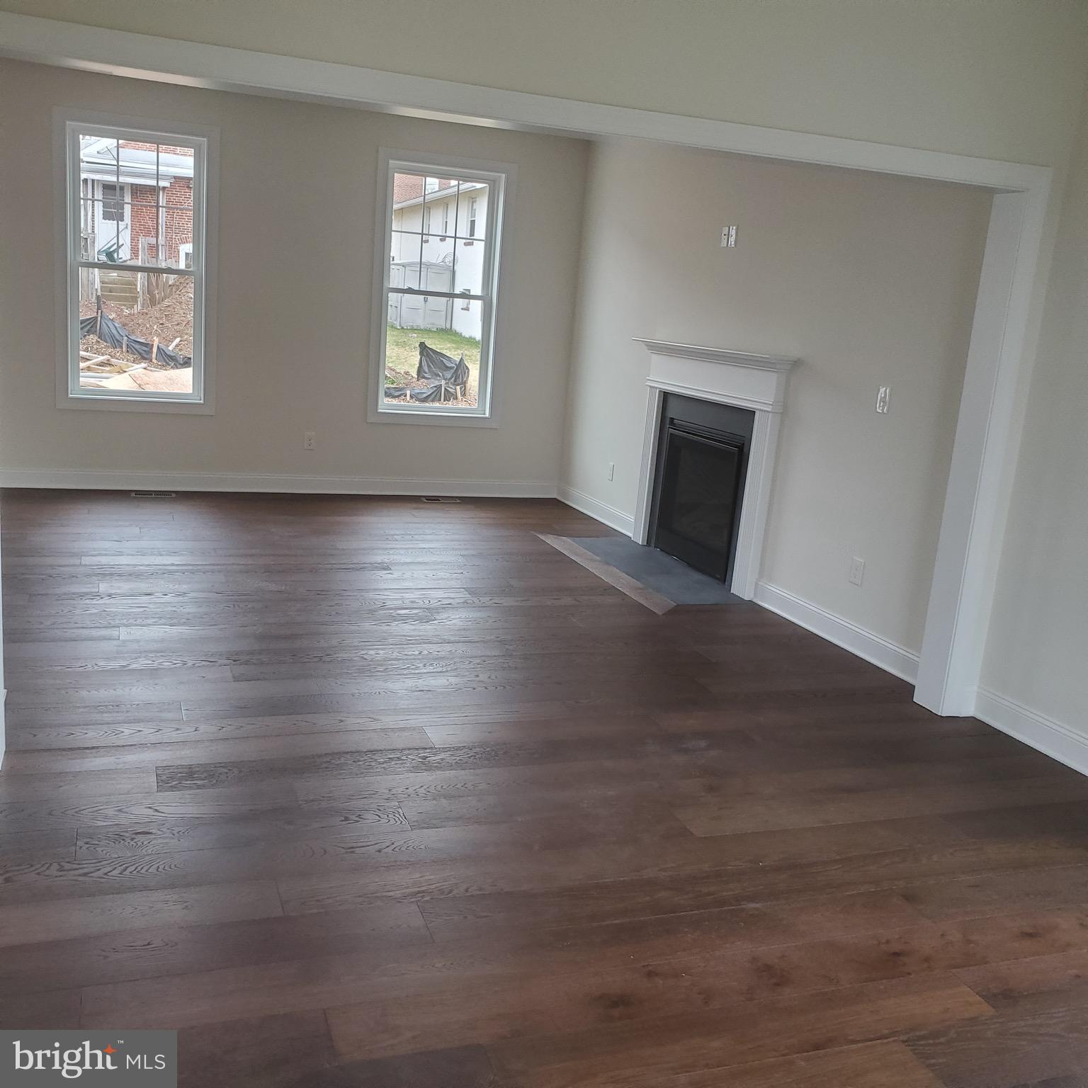 336 Conestoga Road Malvern, PA 19355 - Photo 2 of 5 an empty room with wooden floor and windows