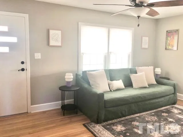 a living room with furniture and a window