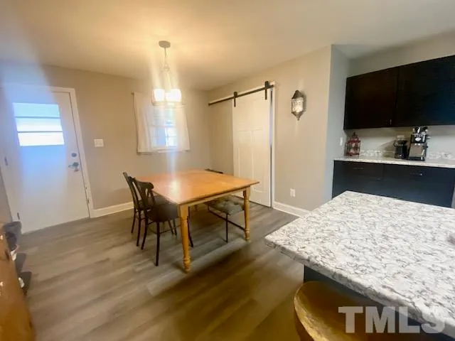 a view of a dining room with furniture