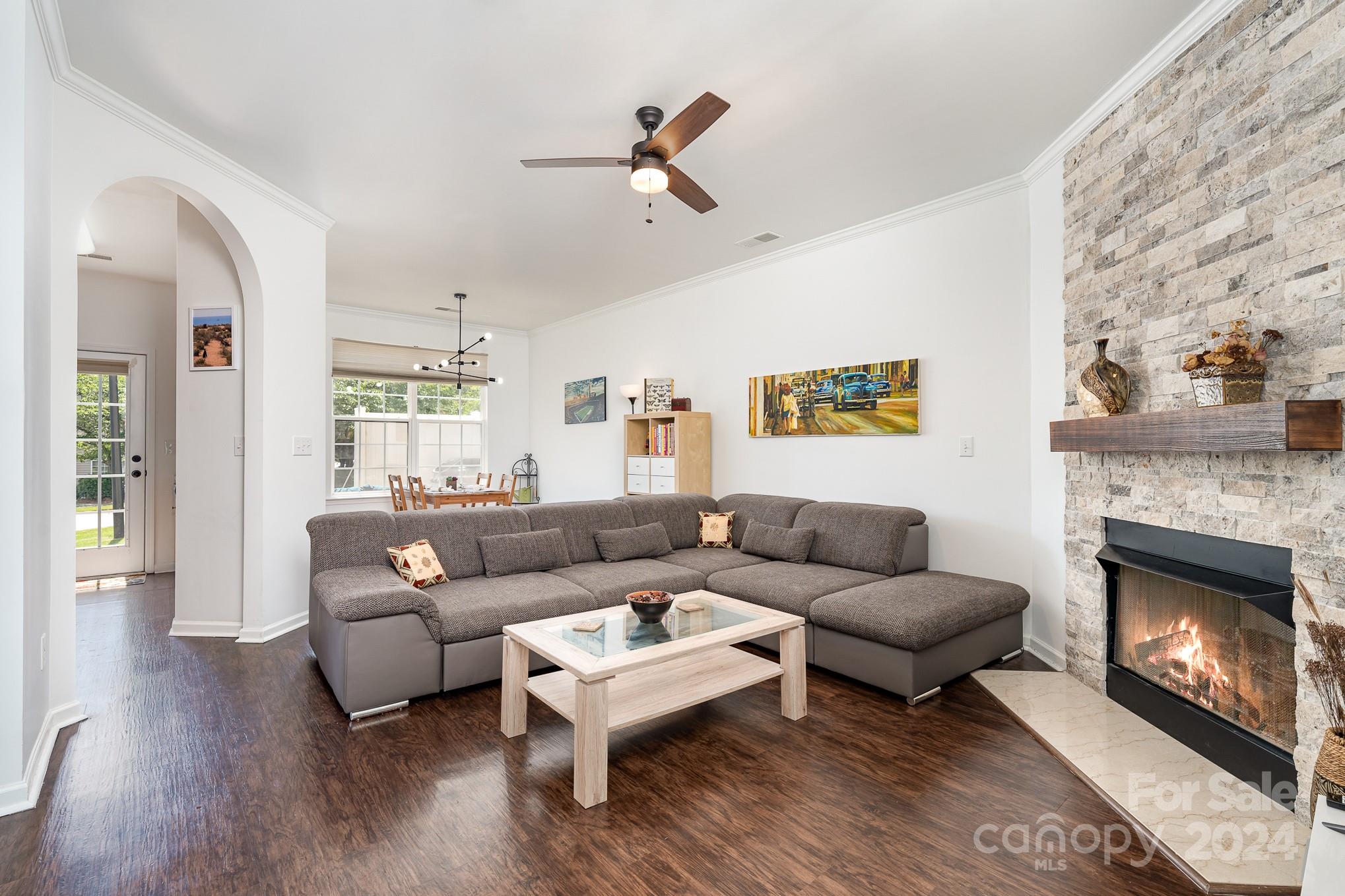 1912 Travertine Lane Fort Mill, SC 29708 - Photo 4 of 25 a living room with furniture a fireplace and a flat screen tv
