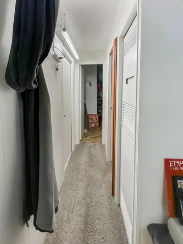 a view of hallway with walk in closet