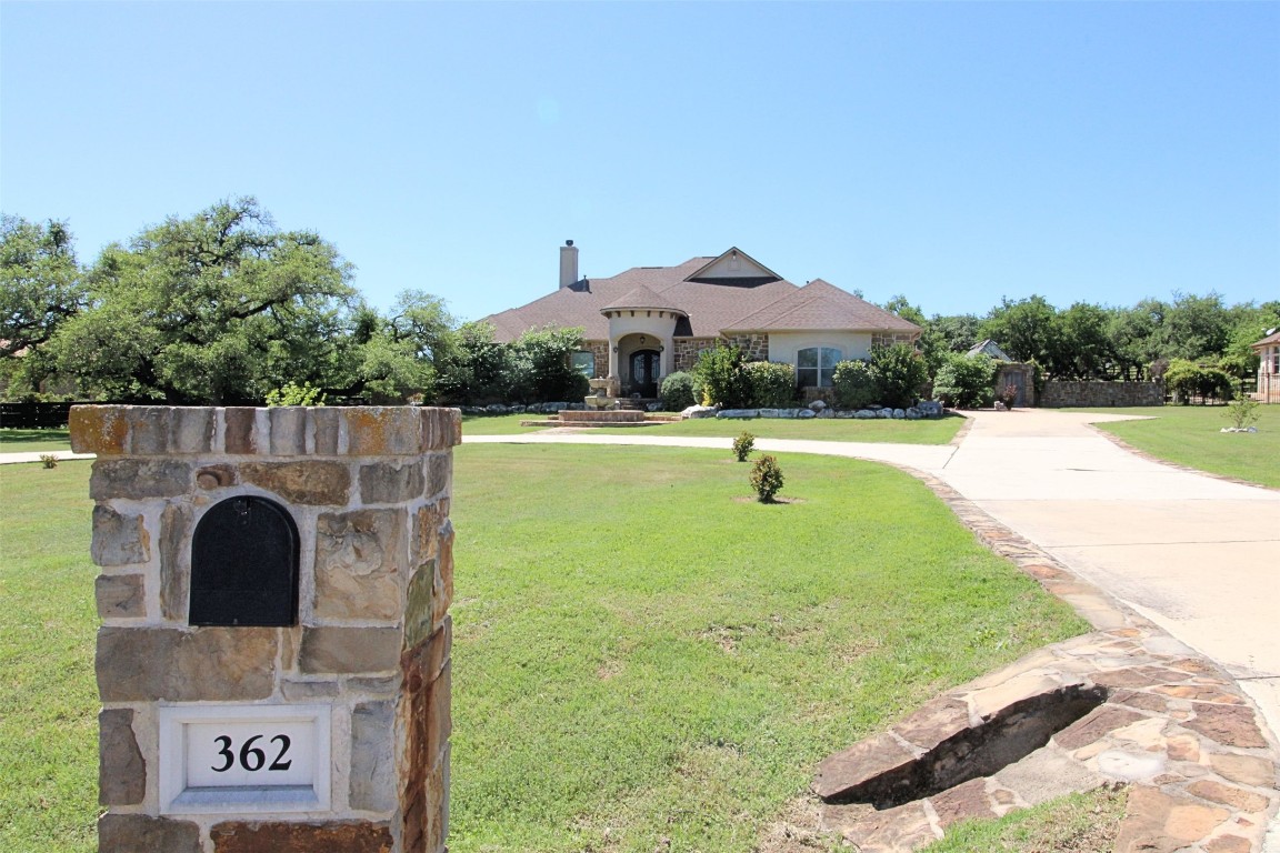362 Ranchers Club. Large Stone lined Circular Drive provides room for multiple Guests