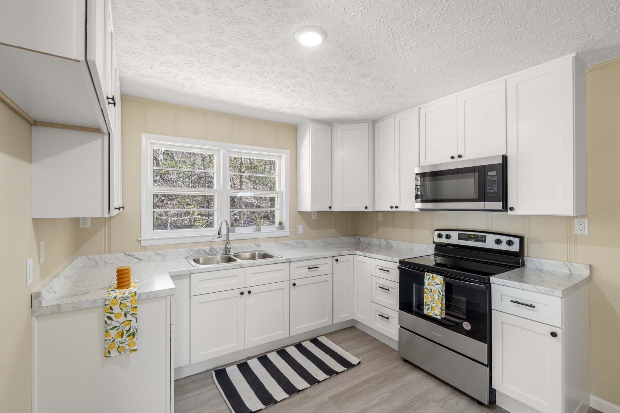351 Highway 100 Centerville, TN 37033 - Photo 11 of 31 a kitchen with a sink stove and microwave