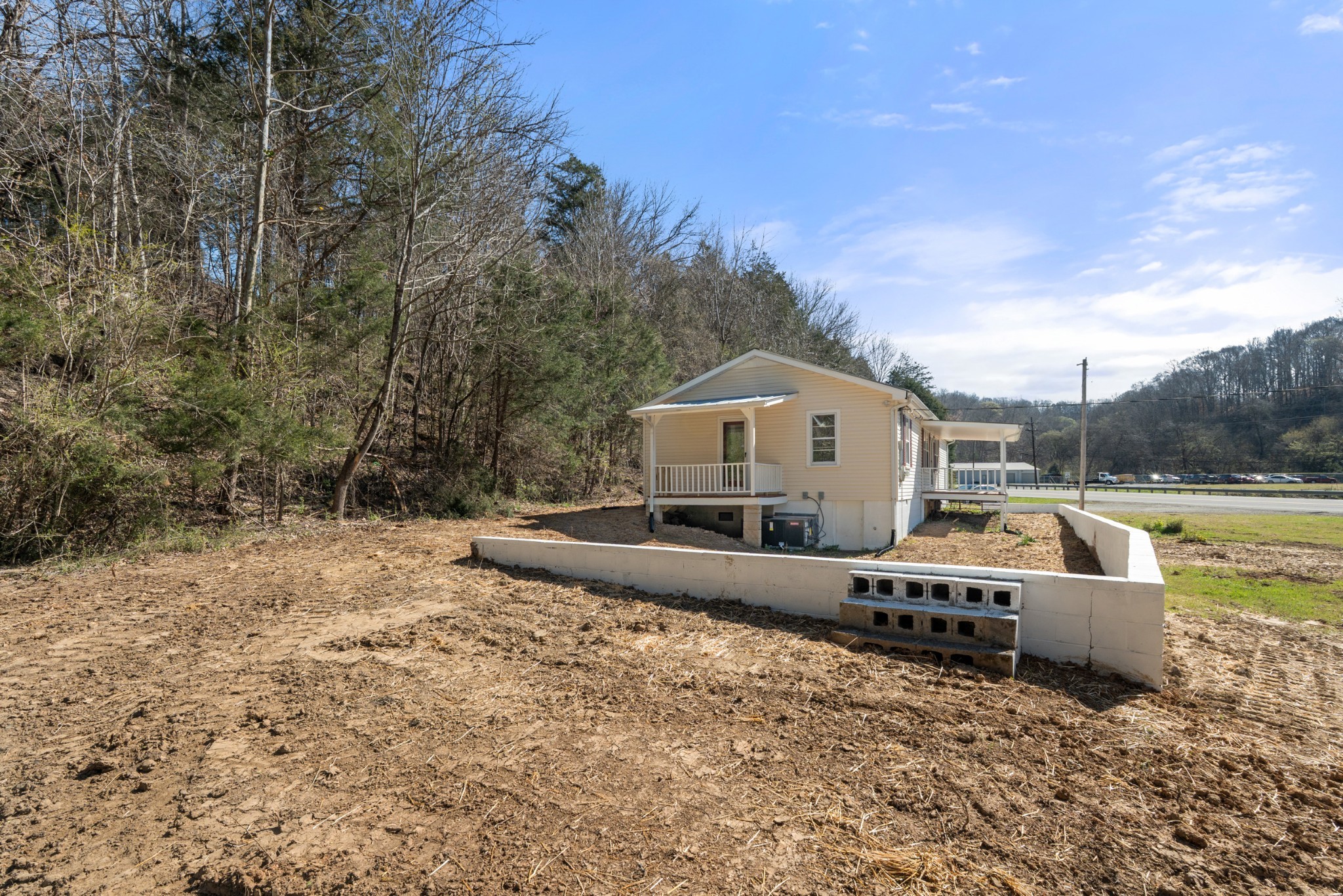 351 Highway 100 Centerville, TN 37033 - Photo 20 of 31 a large white house with a large pool and trees in the background