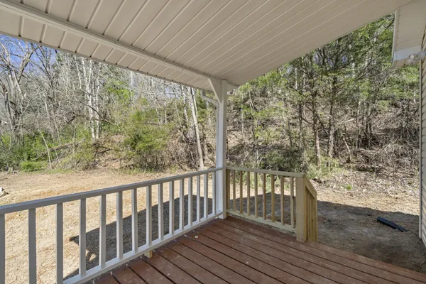 a view of a porch with wooden floor
