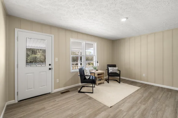 a living room with furniture and a window